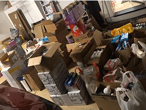 Room filled with donated food and hygiene products